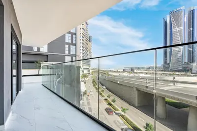 a balcony with a view of the city at Stylish Home with Direct Pool Access by the Canal in Dubai