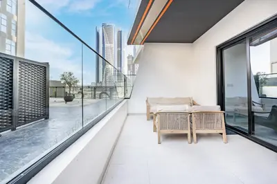 a balcony with a view of the city at Stylish Home with Direct Pool Access by the Canal in Dubai