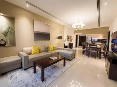a living room with a couch and a table at Prime 2BR with Burj Khalifa & Dubai Canal View - 20AB16 in Dubai