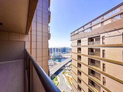 a view from the balcony of a building at Prime 2BR with Burj Khalifa & Dubai Canal View - 20AB16 in Dubai