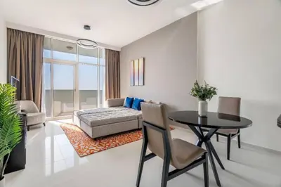 a living room with a table and a couch at Exquisite 1Bedroom With City Views in Dubai