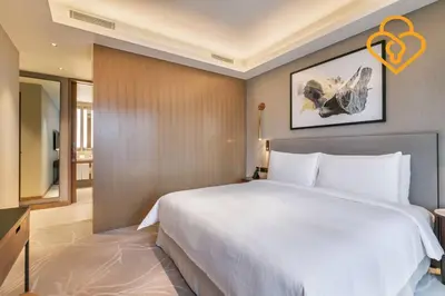 a bedroom with a large white bed in a room at Keysplease Address Opera 2BR Downtown 26 in Dubai