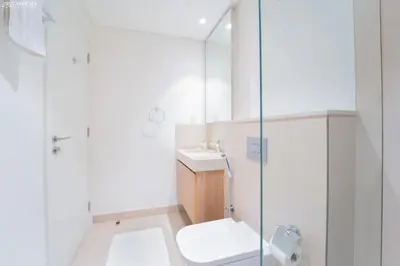 a bathroom with a shower and a toilet and a sink at Downtown Views Tower 2 brand new apt in Dubai