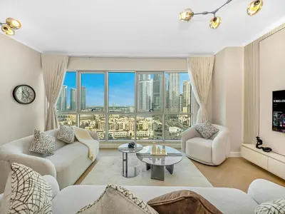a living room with a view of a city at Burj Khalifa & Fountain Show Views 4 BHK In Downtown, 2 minutes walk to Dubai Mall in Dubai