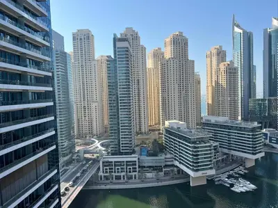 an aerial view of a city with tall buildings at The Smart Concierge - Silverene in Dubai