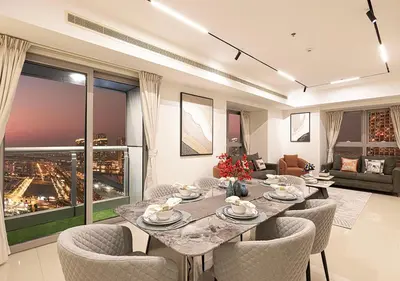 a dining room with a table and chairs and a living room at Coastal Marina Escape - 4 BR Sea, Dubai Eye & Palm View in Dubai