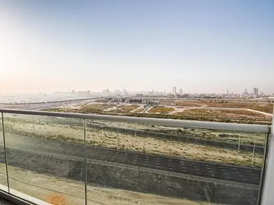 a view of the city from the balcony of a building at Cozy and Stylish Studio Retreat in DAMAC Hills in Dubai
