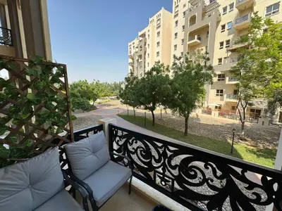 a balcony with a bench and a view of a street at Lovely Brand new 3 BR with maids room in Dubai