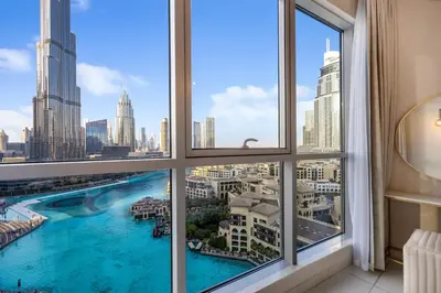 a view from a window of a city skyline at Durrani Homes - Lumina Grand 3BR with Burj khalifa and Fountain Views in Dubai