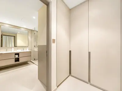 a bathroom with a shower stall and a mirror at Grandeur 2 Bedroom Apartments I Burj Khalifa & Fountain Views I Free Parking, Gym, Pool, Wi-Fi & PS5 I by Skyline Serenity in Dubai