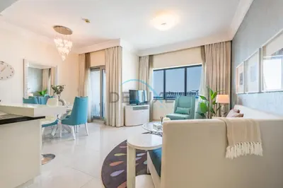 a living room with a couch and a table at Lovely 2BR at The Signature, Downtown Dubai by Deluxe Holiday Homes in Dubai