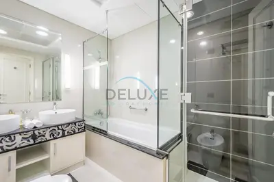 a bathroom with a glass shower and a sink at Lovely 2BR at The Signature, Downtown Dubai by Deluxe Holiday Homes in Dubai
