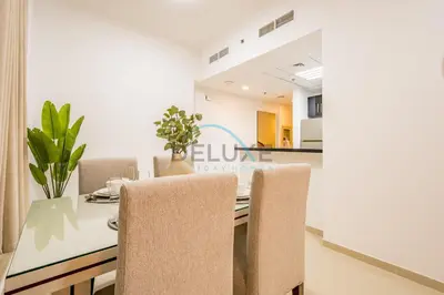 a dining room with a table and chairs at Stunning 1BR Apartment at Botanica Tower 1, Dubai Marina by Deluxe Holiday Homes in Dubai
