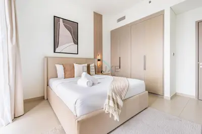 a bedroom with a large white bed in a room at Magnificent 2BR Apartment at Act One Act Two Tower 2 in Downtown Dubai by Deluxe Holiday Homes in Dubai