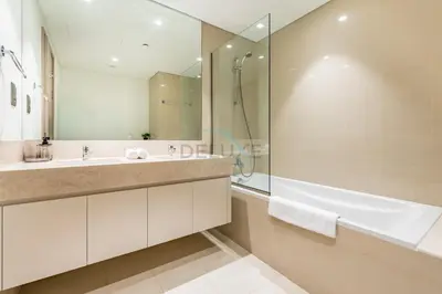 a bathroom with a tub and a sink and a shower at Magnificent 2BR Apartment at Act One Act Two Tower 2 in Downtown Dubai by Deluxe Holiday Homes in Dubai