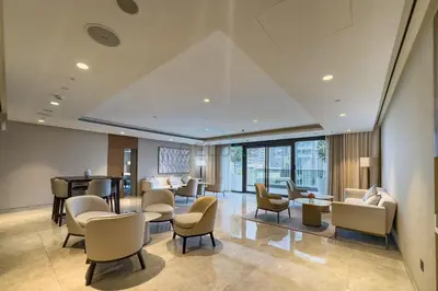 a waiting room at a hospital with chairs and tables at Magnificent 2BR Apartment at Act One Act Two Tower 2 in Downtown Dubai by Deluxe Holiday Homes in Dubai