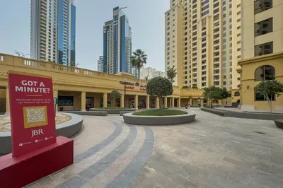a shopping center in a city with tall buildings at Breathtaking Scenery- JBR Walk- Beach Access in Dubai