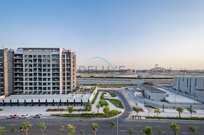 an aerial view of a city with buildings and a street at Chic Studio in Azizi Riviera 44, Al Merkadh by Deluxe Holiday Homes in Dubai