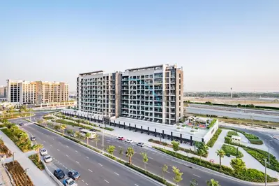 an aerial view of a city street with buildings at Chic Studio in Azizi Riviera 44, Al Merkadh by Deluxe Holiday Homes in Dubai