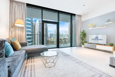 a living room with a couch and a large window at Stunning Home Overlooking the Burj Khalifa in Dubai