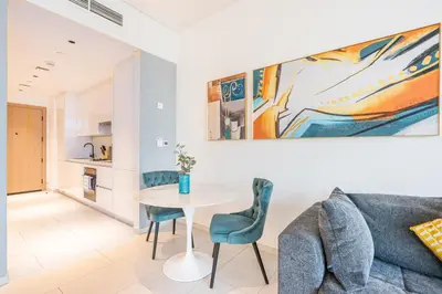 a living room with a table and a couch at Stunning Home Overlooking the Burj Khalifa in Dubai
