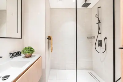 a bathroom with a shower and a sink at Stunning Home Overlooking the Burj Khalifa in Dubai