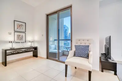 a living room with a desk and a chair at Elite 1 BR in JBR with Marina Views in Dubai