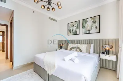 a bedroom with a large white bed in a room at Spacious 3BR Apartment with Assistant Room & Stunning Creek Views in The Dubai Creek Residences South Tower 1, Creek Harbour by Deluxe Holiday Homes in Dubai