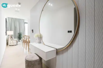 a bathroom with a sink and a mirror on the wall at HiGuests - Luxury Apt in the Heart of JVC at Binghatti Nova in Dubai