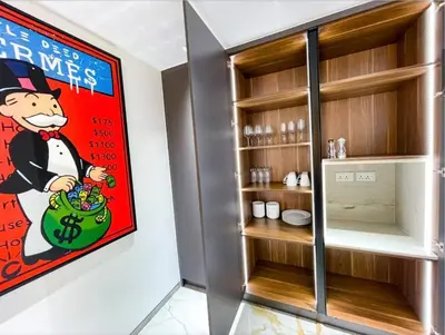 a room with a wall with a poster of a cartoon at Luxury 4 Bed Apartment in Sadaf 8 on The Walk JBR in Dubai