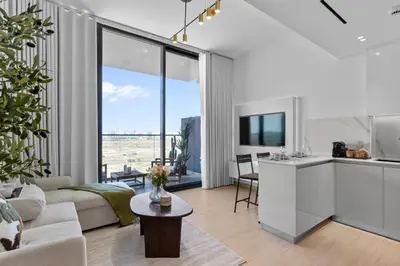 a living room with a couch and a table at Elegant Living in 1 BDR at JVC with Top Amenities in Dubai