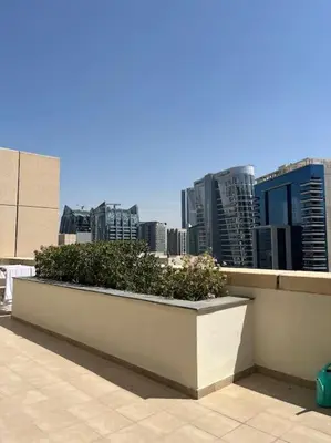 a planter on a balcony with a view of a city at Apartment in Business Bay, Dubai UAE in Dubai
