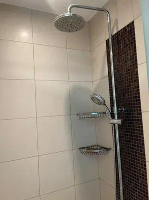 a shower with a glass door in a bathroom at Apartment in Business Bay, Dubai UAE in Dubai