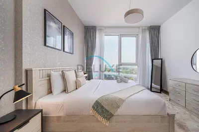 a bedroom with a large bed and a window at Contemporary 1BR in Al Kifaf Residences West, Bur Dubai by Deluxe Holiday Homes in Dubai