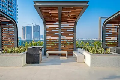 a patio with a bench and a view of the city at Contemporary 1BR in Al Kifaf Residences West, Bur Dubai by Deluxe Holiday Homes in Dubai