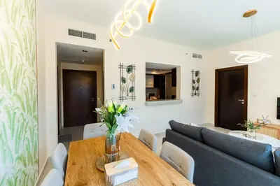 a living room with a table and a couch at Chic 1BR Marina View Retreat in Dubai