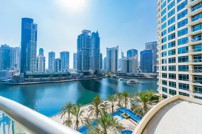 a view of a river in a city with tall buildings at Chic 1BR Marina View Retreat in Dubai