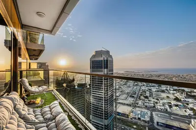 a view of the city from the top of a building at 64th floor Skyline Pool with Burj Khalifa View in Paramount Hotel Midtown in Dubai