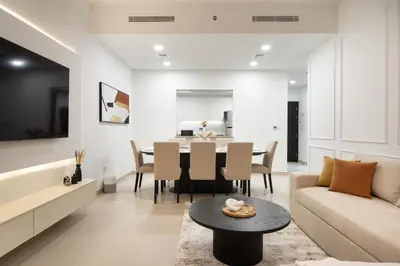 a living room with a couch and a table at Bellevue Towers by Luxe Living - Full Burj Khalifa View in Dubai