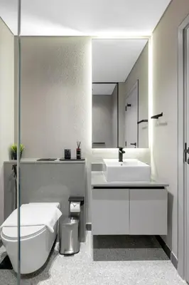 a bathroom with a white toilet and a sink at Modern Meydan Studio Apartment - 15 min Drive to Downtown Dubai Mall in Dubai