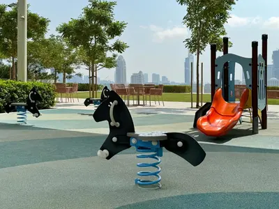a playground with a toy dog on a swing at Atlantis View 1BR with Beachfront Access and Balcony in Dubai