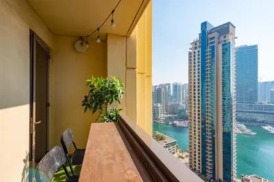 a balcony with a table and a view of the city at Rimal 4, JBR- Elegant 2 BR in Dubai