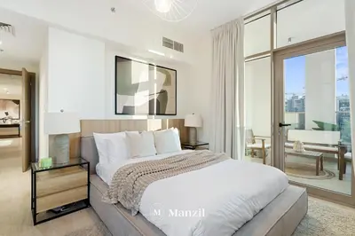 a bedroom with a large bed and a large window at Lux 2BR Apartment Near Dubai Mall & Burj Khalifa in Dubai