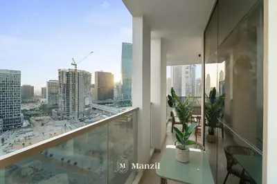 a balcony with a view of a city at Lux 2BR Apartment Near Dubai Mall & Burj Khalifa in Dubai