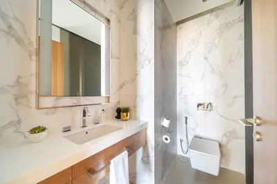 a bathroom with a sink and a mirror at Frank Porter - The Address Opera Residences in Dubai