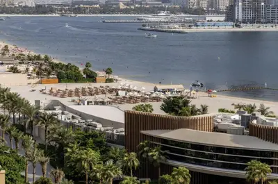 a view of the beach and the ocean at Seven Palm Hotel with West beach access in Dubai