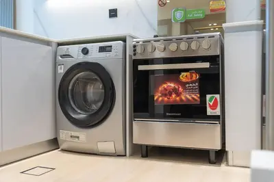 a washing machine and a oven in a store at Luxurious 1-Bedroom Oasis l Binghatti Corner, JVC in Dubai