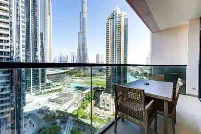 a dining room with a view of the city at Stylish 2 Bed with Stunning Burj Khalifa View in Downtown in Dubai