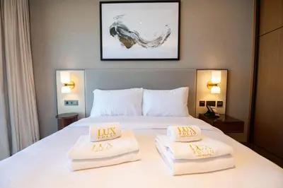 a hotel room with a bed with two pillows on it at Gorgeous High Floor 3-Bed with Full Burj View in Dubai