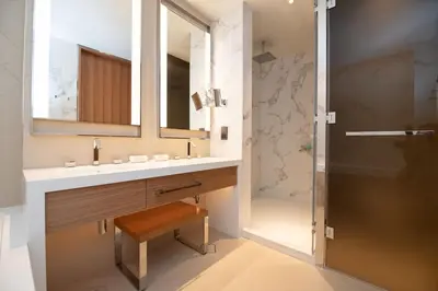 a bathroom with a sink and a shower at Gorgeous High Floor 3-Bed with Full Burj View in Dubai